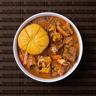 Ogbono Soup with Assorted Meat and Fufu
